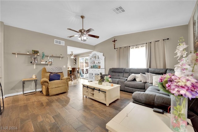 living room with wood-type flooring, lofted ceiling, ceiling fan, and a healthy amount of sunlight