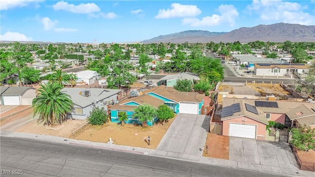 birds eye view of property featuring a mountain view