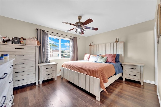 bedroom with dark hardwood / wood-style floors and ceiling fan