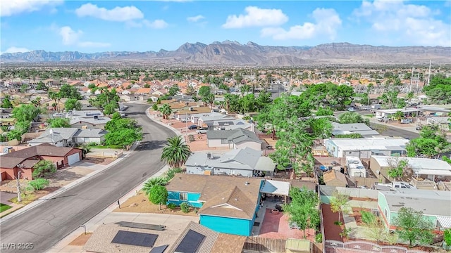 birds eye view of property with a mountain view