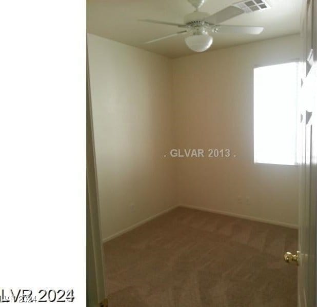 unfurnished room featuring carpet flooring and ceiling fan