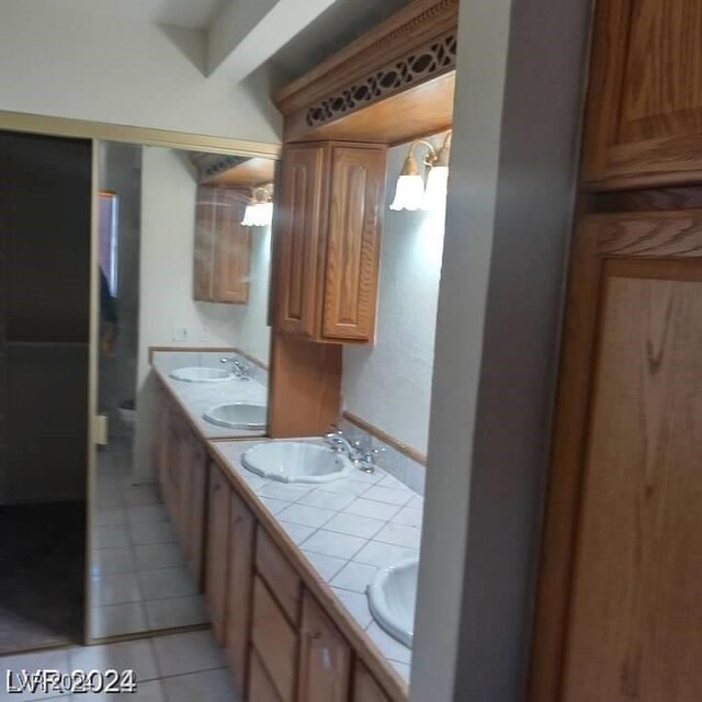 bathroom with vanity and tile patterned flooring