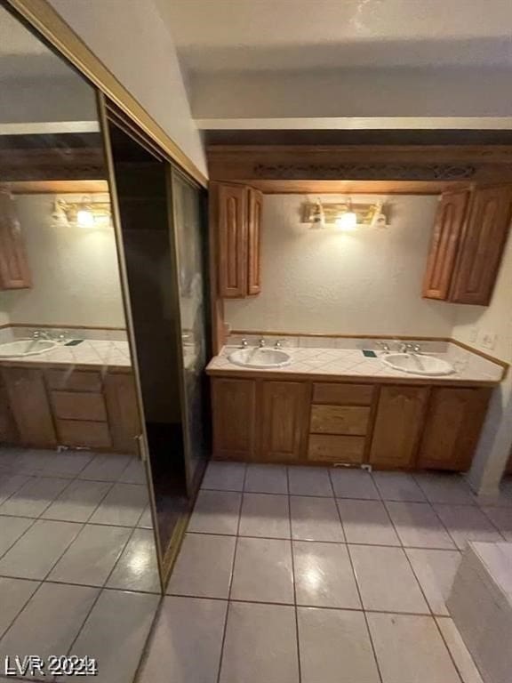 bathroom with vanity and tile patterned flooring