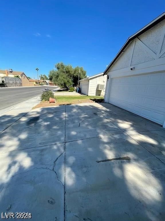 view of property exterior featuring a garage