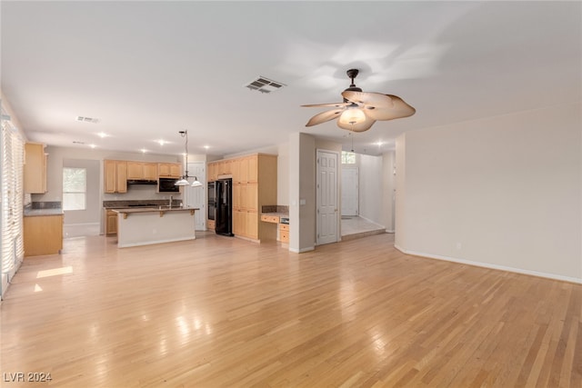 unfurnished living room with light hardwood / wood-style floors and ceiling fan