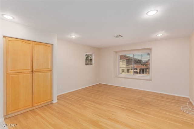 unfurnished room with light hardwood / wood-style flooring