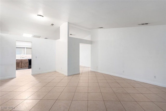 tiled empty room with sink