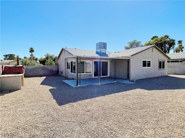 back of house featuring a patio