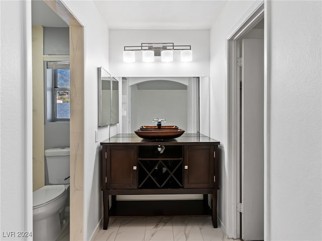 bathroom featuring vanity and toilet