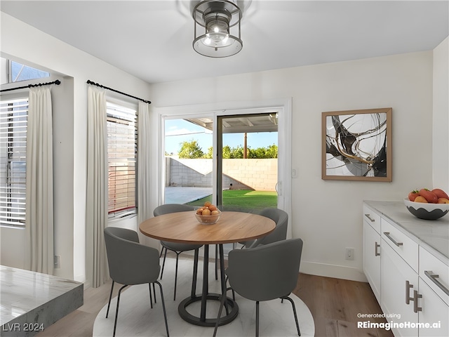 dining space with light wood-type flooring