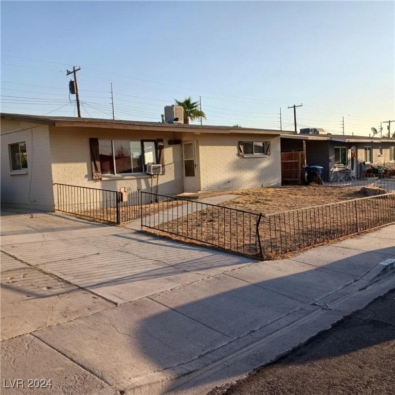 single story home featuring central AC unit