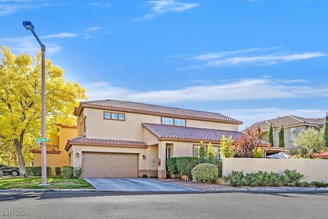 mediterranean / spanish-style home featuring a garage