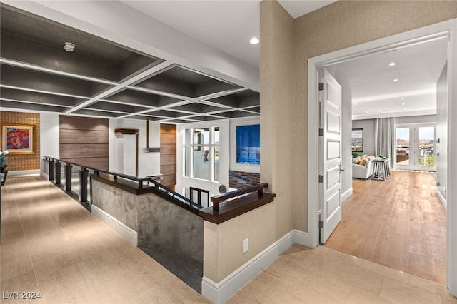 hall with coffered ceiling and french doors