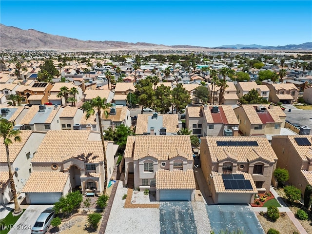 birds eye view of property with a mountain view