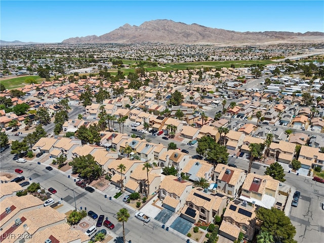 birds eye view of property featuring a mountain view