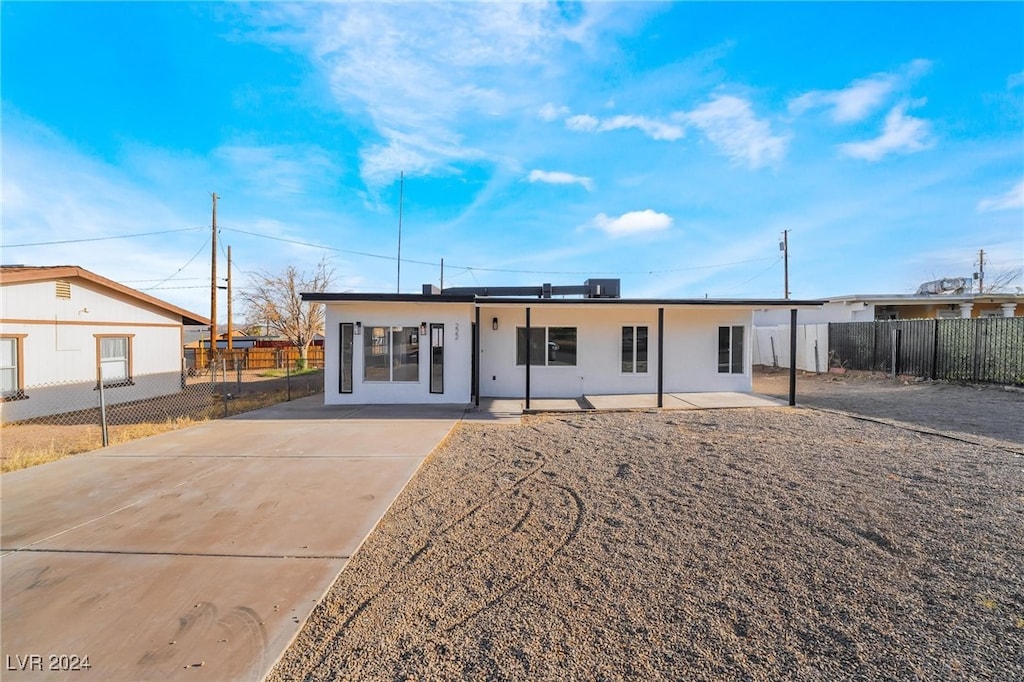 rear view of house featuring a patio