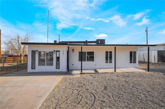 back of property with a patio and central AC unit