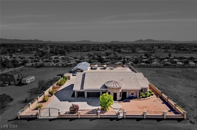 birds eye view of property featuring a mountain view