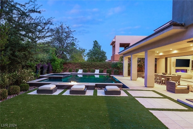 view of swimming pool featuring a patio, a lawn, and outdoor lounge area