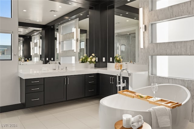 bathroom featuring vanity, shower with separate bathtub, and tile patterned flooring