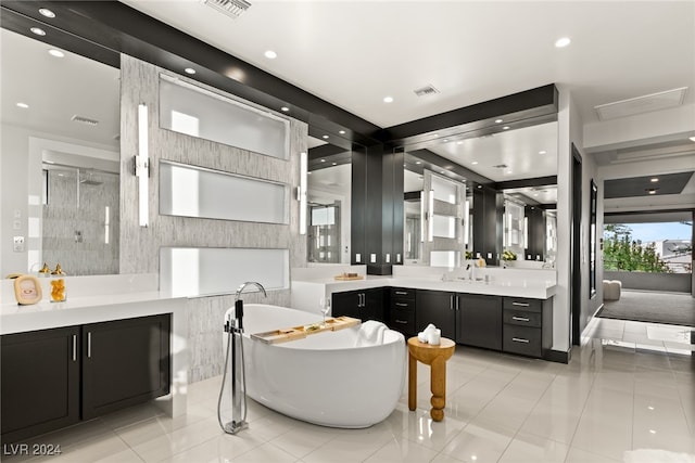 bathroom featuring vanity, shower with separate bathtub, and tile patterned floors