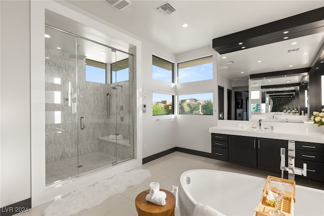 bathroom with vanity, shower with separate bathtub, and tile patterned flooring