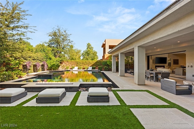 view of swimming pool with an in ground hot tub, a patio area, and an outdoor living space