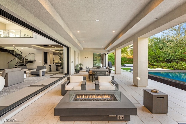 view of patio featuring an outdoor fire pit