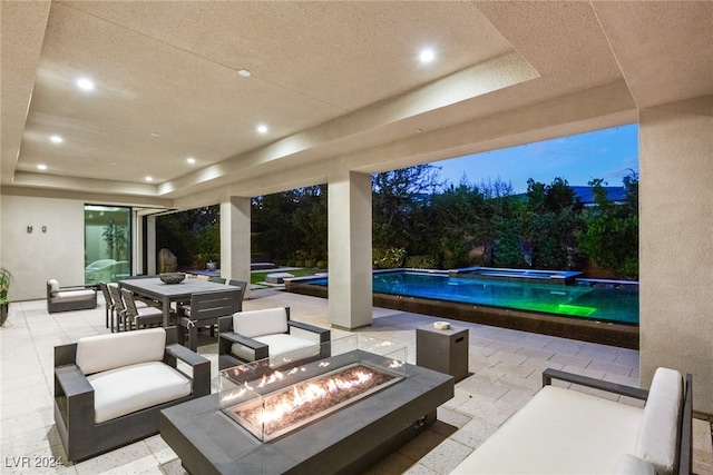 patio terrace at dusk with a fire pit