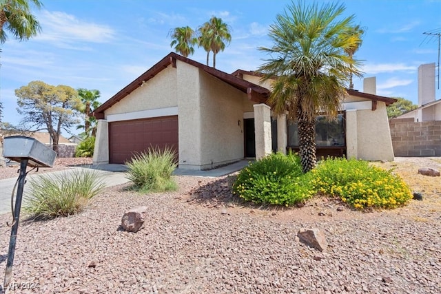 view of front of property with a garage