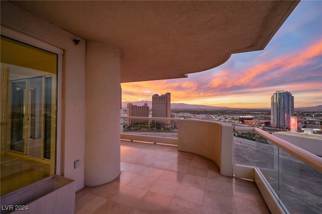 view of balcony at dusk