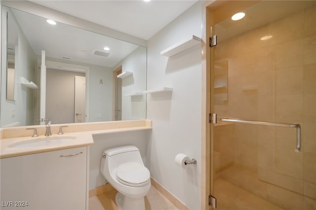 bathroom with tile patterned flooring, vanity, toilet, and an enclosed shower