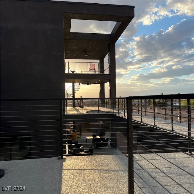 view of balcony at dusk