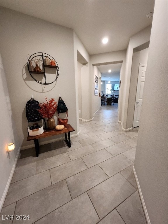 corridor with light tile patterned floors