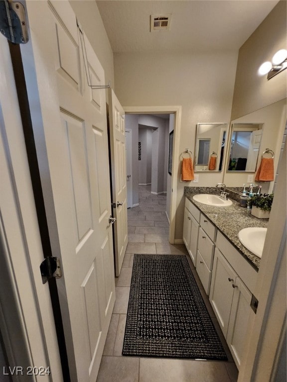 bathroom with vanity and tile patterned flooring