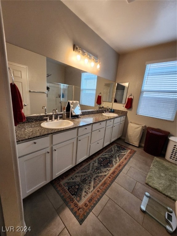 bathroom with vanity, tile patterned floors, and walk in shower