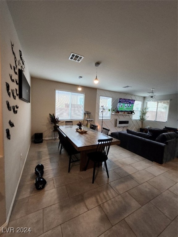 dining space featuring a healthy amount of sunlight and tile patterned flooring