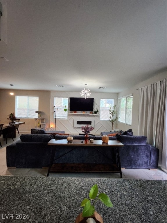 tiled living room with a healthy amount of sunlight