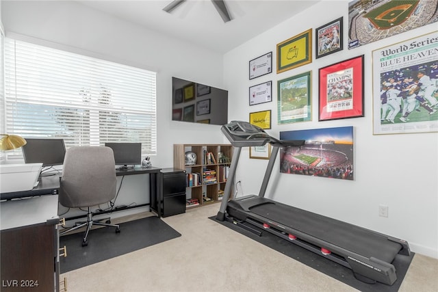 exercise area with light carpet and ceiling fan