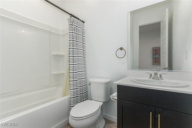 full bathroom with hardwood / wood-style flooring, vanity, toilet, and shower / tub combo with curtain