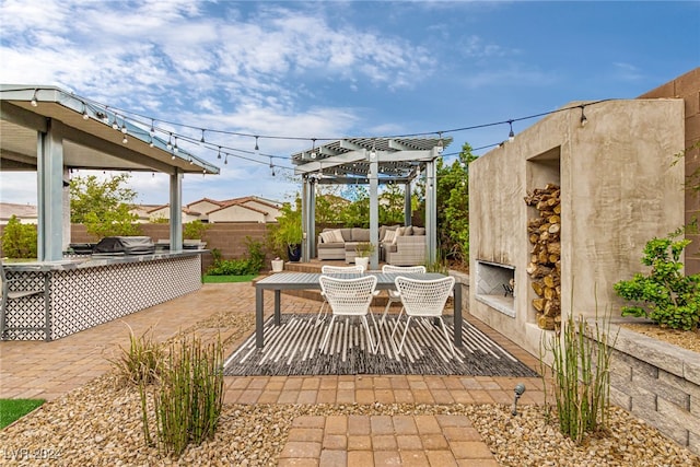 view of patio / terrace with an outdoor living space with a fireplace