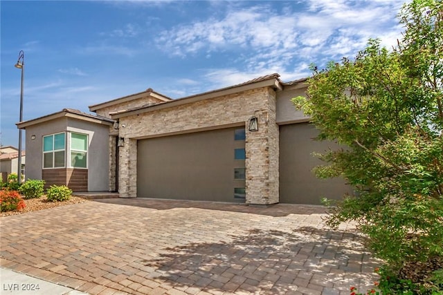 view of front of property with a garage