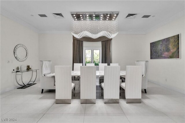 tiled dining room with an inviting chandelier and ornamental molding