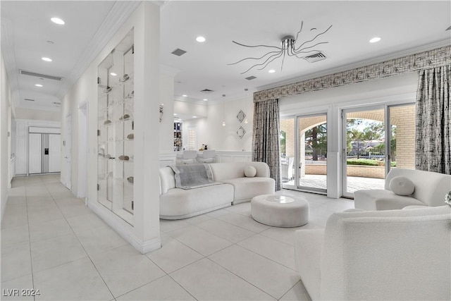 living room with crown molding, light tile patterned flooring, and a notable chandelier