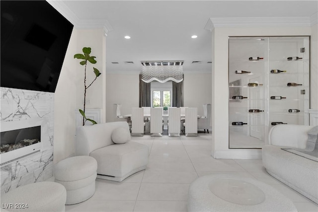 bathroom featuring tile patterned floors, ornamental molding, and a premium fireplace