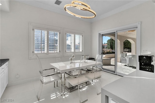 tiled dining space with an inviting chandelier, a wealth of natural light, and crown molding