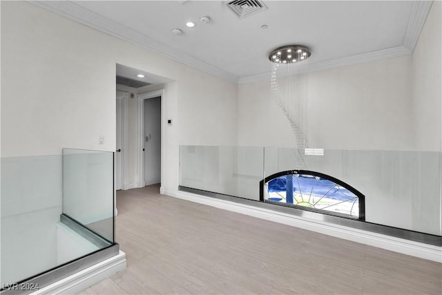 interior space with crown molding and hardwood / wood-style flooring