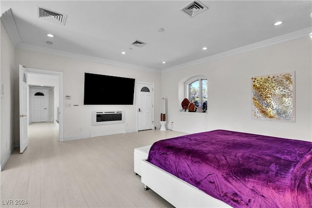 bedroom with light wood-type flooring and ornamental molding