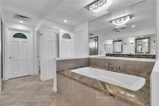 bathroom with tiled tub, tile patterned flooring, vanity, and ornamental molding