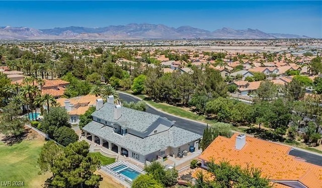 birds eye view of property with a mountain view